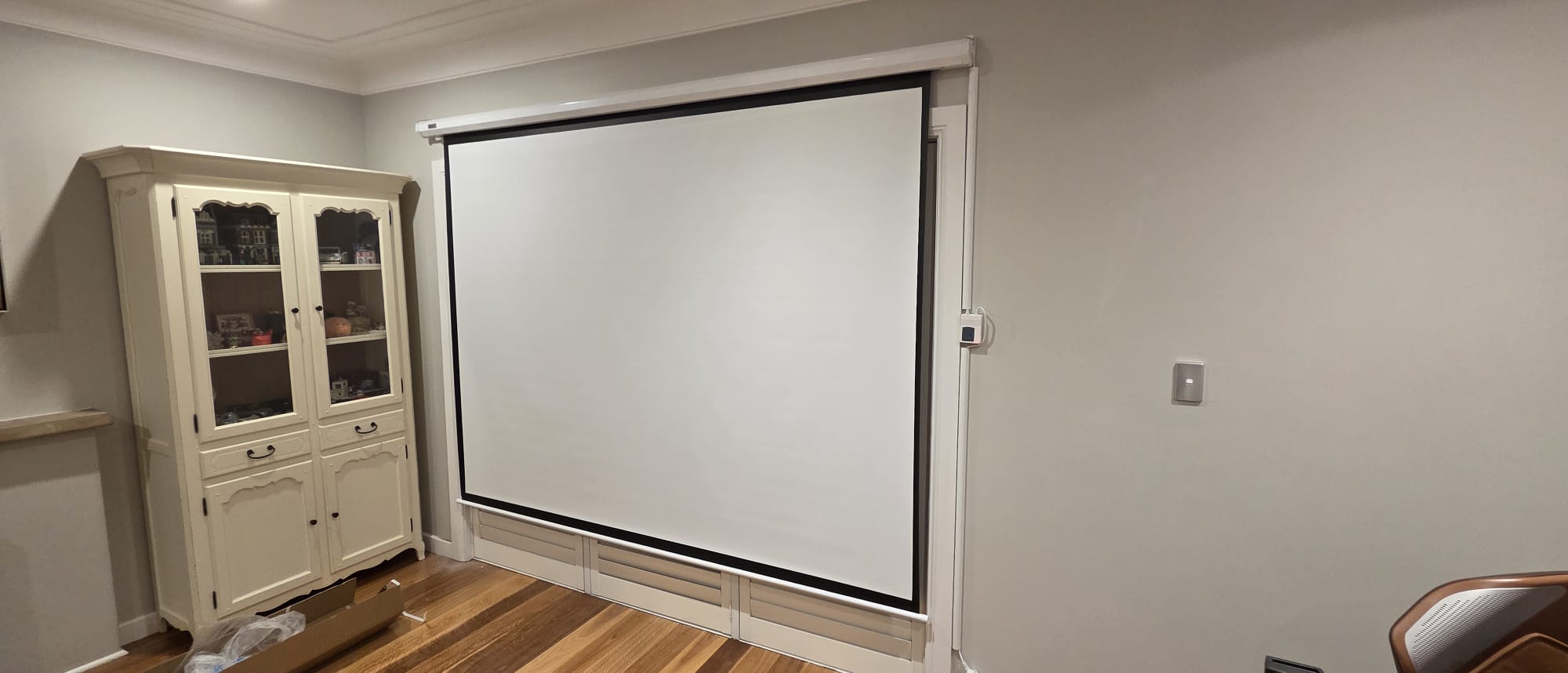 Motorised screen mounted and wired